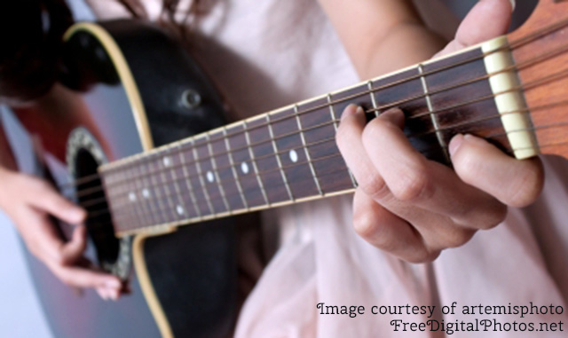 woman playing guitar