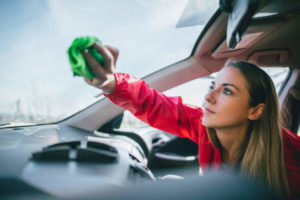 woman-cleaning-car