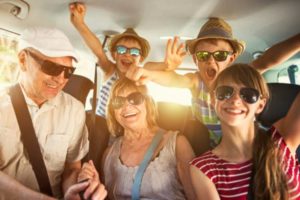 grandparents-children-road-trip-car